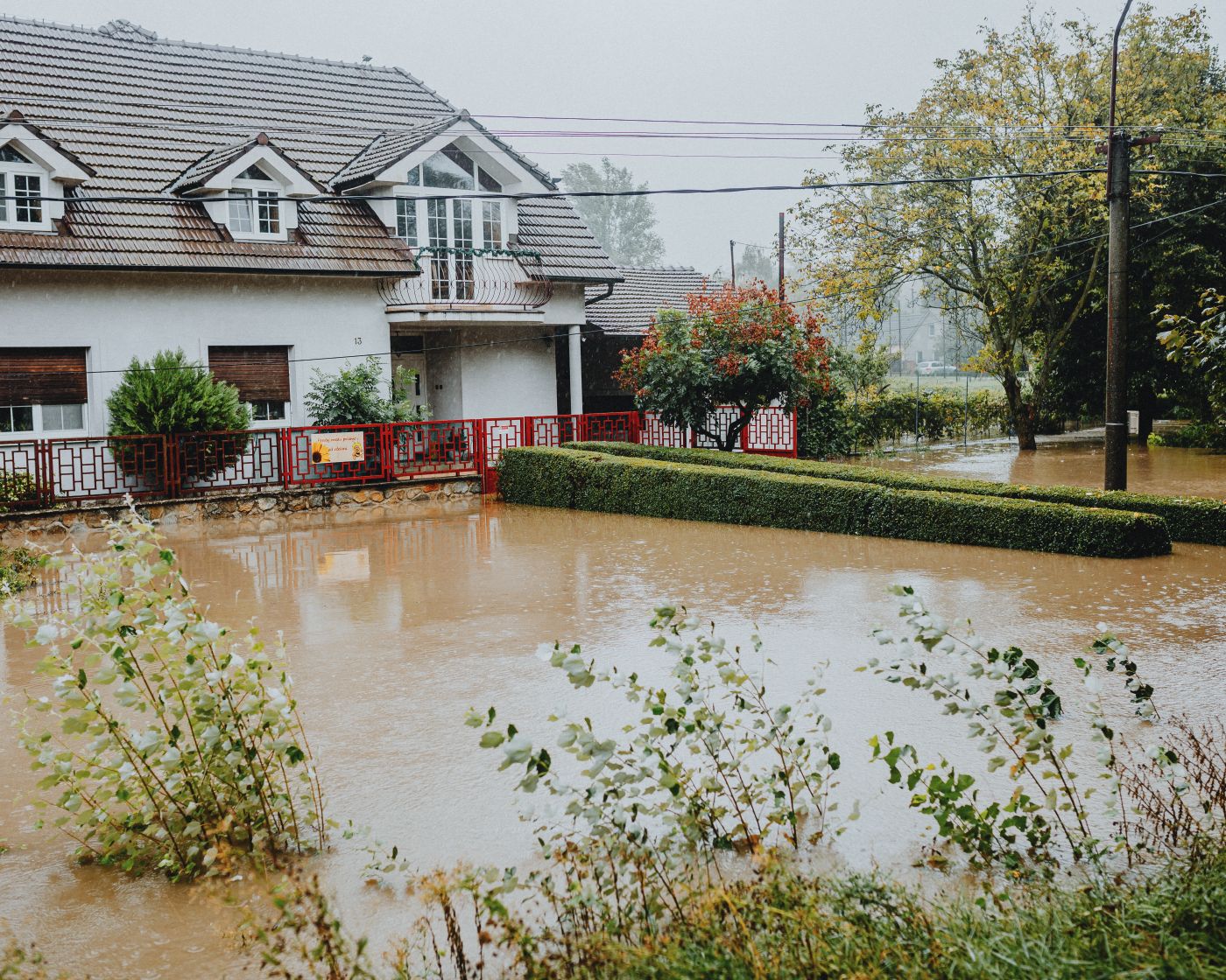 Flooded suburban street of the kind Long Beach sees in a serious storm