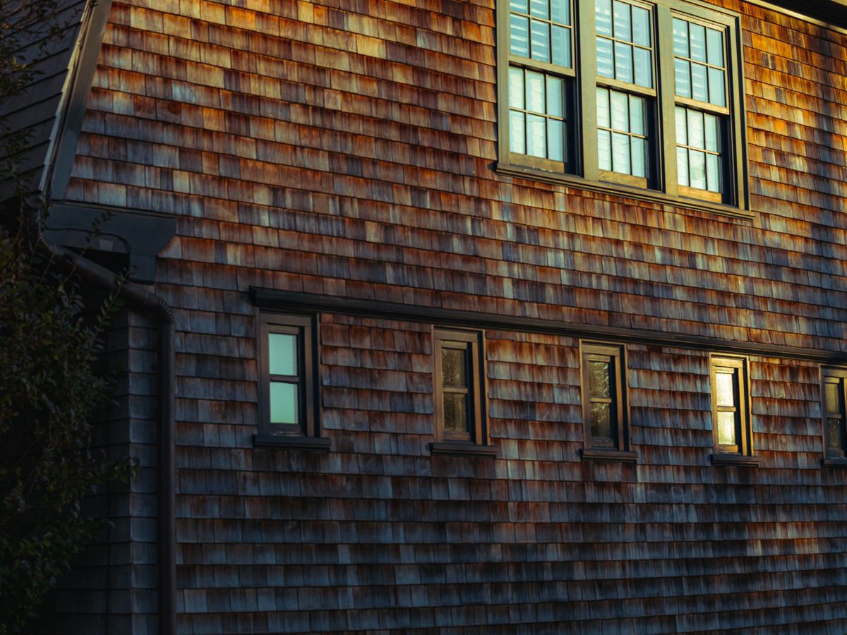 Sunlit cedar shingle facade of a coastal Long Island house